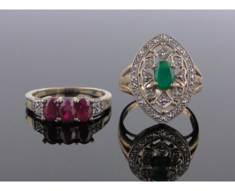 A 9 ct gold 3 stone ruby ring,& a 10 ct gold emerald & diamond panel ring (2)