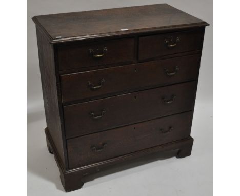 A George III oak chest of 2 short and 3 long drawers, bracket feet, width 3'1", height 3'3", depth 1'8".