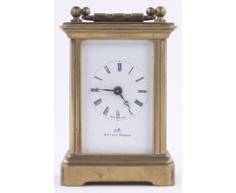 A Miniature Swiss made brass cased carriage clock,dial marked Matthew Norman, height excluding handle 3"
