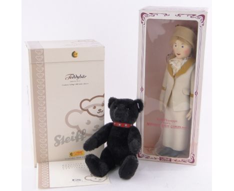 A modern Steiff black growling teddy bear,height 12", & a limited edition Steiff felt doll (both boxed) (2)