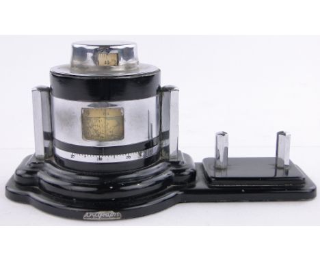 An unusual Art Deco Unigraph chrome mounted desk barometer c. 1930,registered no. 843105, the lid having an inset thermometer