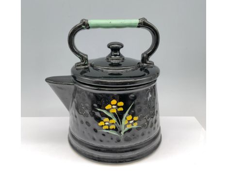 Gorgeous black colored and hand painted container used to store cookies that is themed as a vintage tea kettle. McCoy backsta
