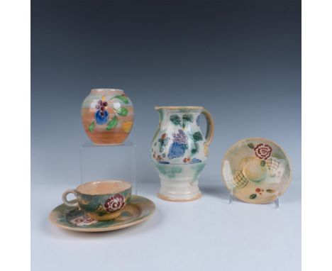 A pitcher (D5034), bowl (6120), and tea trio (D5035) showcase designs in blue, brown, and green, featuring artwork of crops a