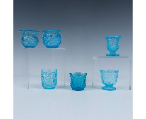 Lot of 6 beautiful light blue glass toothpick holders. Three have a button and daisy pattern, one has an interlocking chain, 