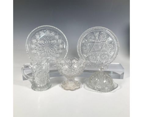 A remarkable collection featuring two round serving dishes, a small footed punch bowl, a round butter plate with lid, and a s