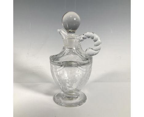 Beautiful 3oz cruet with stopper in the Mayflower pattern. The item is made from depression glass and its handle looks like a