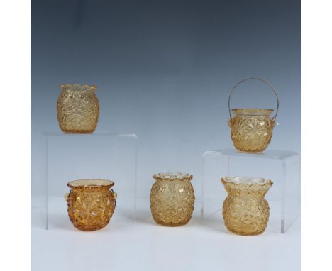 A delightful set of five round yellow art glass toothpick holders features mesmerizing kaleidoscope like patterns on their su
