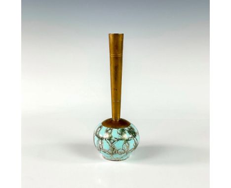 Turquoise with lustre finish and branch patterning. Round body. Narrow brass spout. Gold Delft sticker on front of piece. Fad
