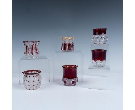 Early American Pattern Glass in clear and ruby stain. Designs include scalloped edges and daisy and button patterns, plus oth