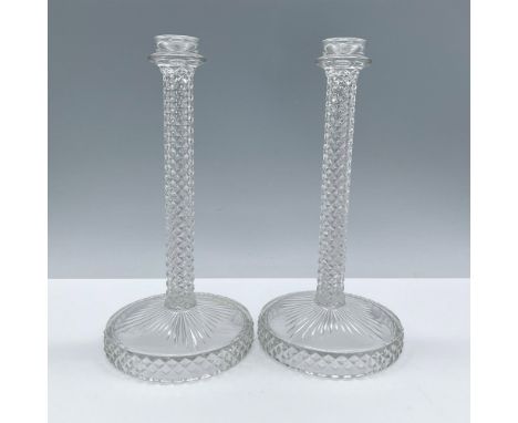 Beautiful clear glass with an elegant vintage design. The stem features a textured diamond pattern and the base a beautiful s