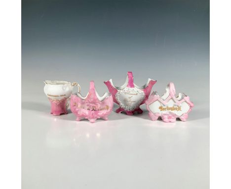 This charming four-piece set features white and pink porcelain souvenirs adorned with gilt embellishments, each inscribed wit