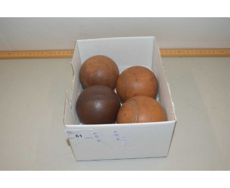 Four vintage wooden balls