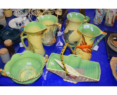 Collection of Art Deco style Burleigh ware, jugs decorated with figures and animals, a further similar bowl and a small plant