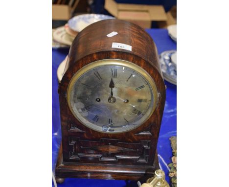 An early 20th Century oak cased mantel clock with brass movement striking on a coiled gong