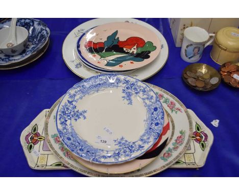 Collection of various decorated plates to include an oval meat plate, hand  painted plates in the Clarice Cliff style etc