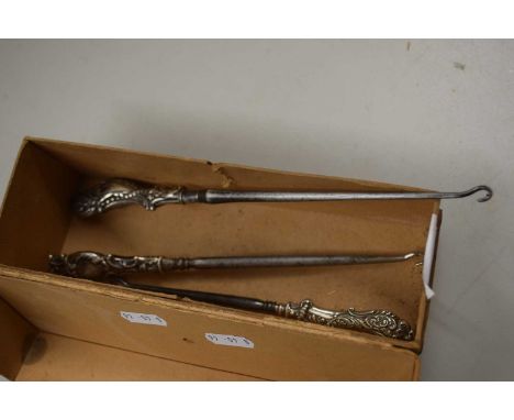 Three vintage white metal topped button hooks
