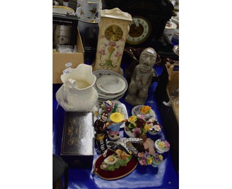 Mixed Lot: Various porcelain flowers, assorted decorative plates, porcelain cased mantel clock, carved stone figure etc