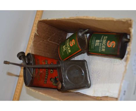 A collection of vintage oil cans to include Singer