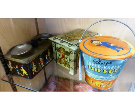 A William Crawford & Sons Ltd novelty scales-nursery biscuit tin, the wood effect tin with nursery children playing, the lift