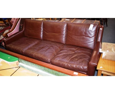 A mid-century Borge Morgensen style Danish rosewood and brown leather three seaster sofa.