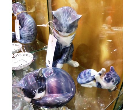 Three Royal Copenhagen cat figurines, to include a seated cat (340); Sleeping cat (442); Playful kitten (727).