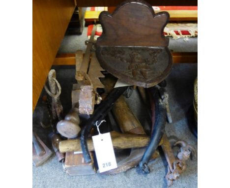 A collection of vintage tools and farming equipment.