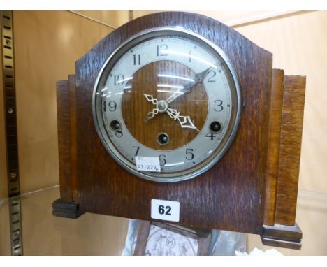 An Enfield Clock Co vintage oak cased mantle clock with Westminster chimes, with pendulum.