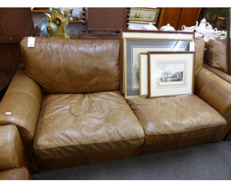 A distressed tan leather three seater sofa. (OPTION)