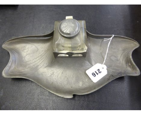 An Art Nouveau pewter inkstand by Orivit, with glass inkwell with pewter hinged cover, signed '" ORIVIT " 2354' to base, 12½i
