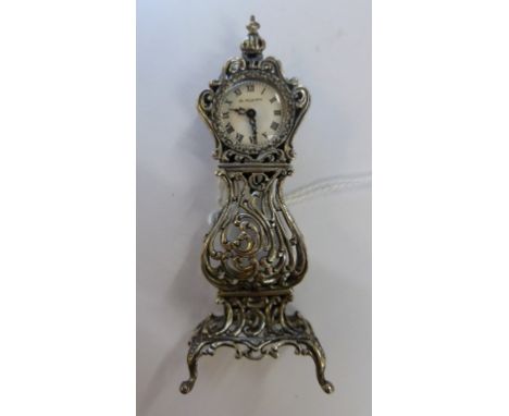 A German novelty silver miniature longcase clock, the clock face marked G. KÜHN, 8cm. high.