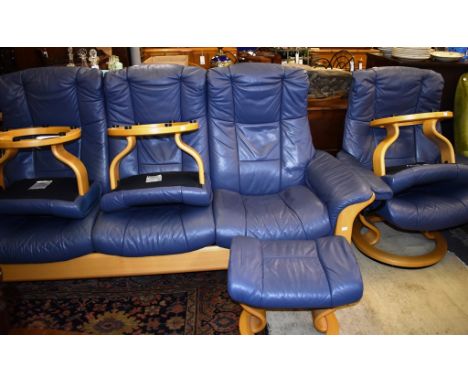 A blue leather Stressless sofa together with a matching reclining armchair and four stools (6)