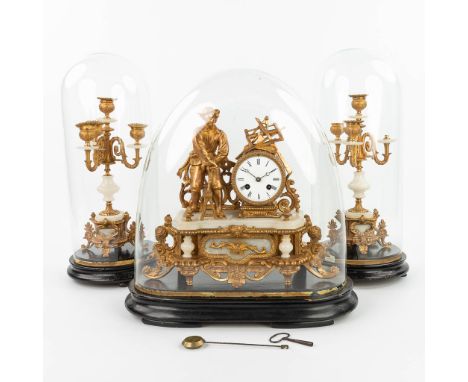 A three-piece mantle clock made of gilt spelter and alabaster, standing under three globes. Sizes for clock. condition: candl