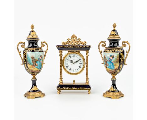 A three-piece mantle garniture with clock and side pieces made of porcelain in Svres style. Side pieces height: 28 cm. (24 cm