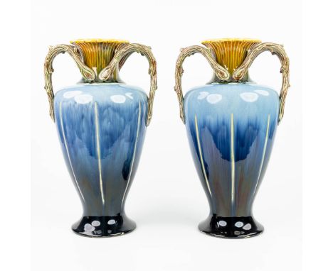 A pair of vases made of glazed faience in art nouveau style and made in Hasselt, Belgium. The first half of the 20th century.