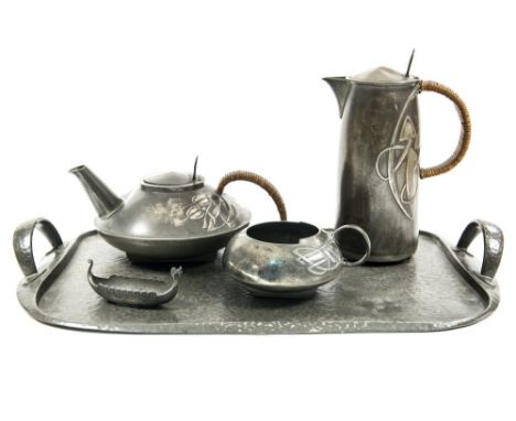 Archibald Knox for Liberty, a Tudric pewter tea set, 0231, stylised bud design, including tray, water jug, teapot and sugar, 