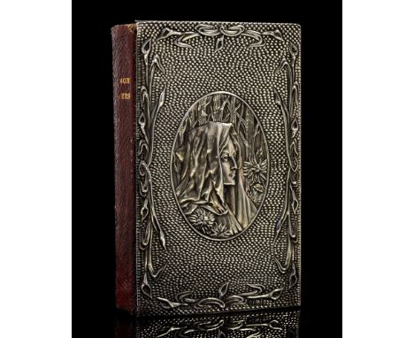 An Arts and Crafts silver covered Book of Common Prayer, the front board embossed with an oval portrait of a woman in forest,