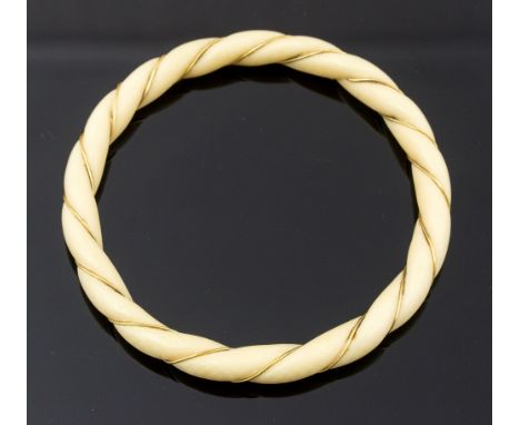 A 1920s ivory and gold thread bangle, ropetwist design, 6.5cm inner diameter, 7.6cm diameter