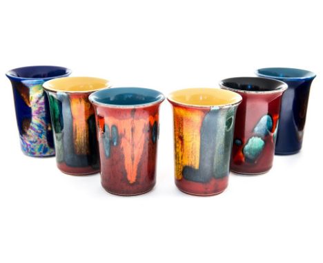 Six various pattern Poole pottery beakers (6)