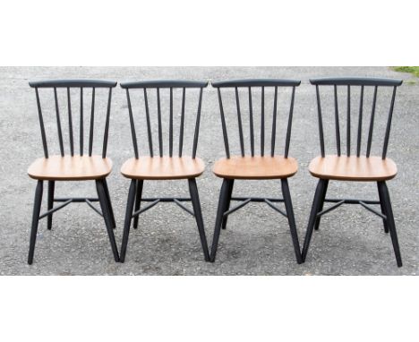 A set of six Ercol style ebonised and teak plywood stick back chairs, together with a circular table (7)