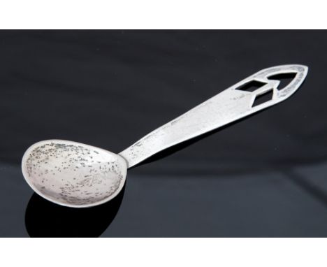 A white metal Scottish Arts and Crafts caddy or preserve spoon, pierced geometric terminal, 13cm long, 0.64ozt