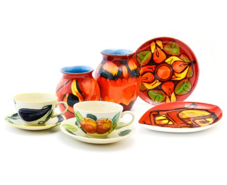 Poole pottery - two vases and two plates, plus two cups and saucers (6) 