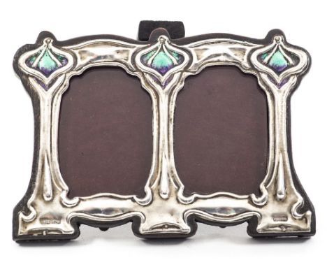 Attributed to Kate Harris for William Hutton, an Arts and Crafts silver and enamelled double photo frame, in the Art Nouveau 
