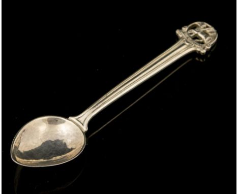Omar Ramsden, an Arts and Crafts silver spoon, hand hammered, the terminal cast and pierced with the emblem of St John the Ba