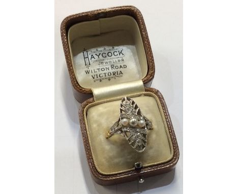 An attractive Antique pearl and diamond oval cluster ring with leaf decoration. Approx 5.4 grams. Est. £200 - £300.