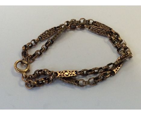 A 9 carat two strand bracelet with ring clasp. Approx. 15.9 grams. Est. £120 - £150.