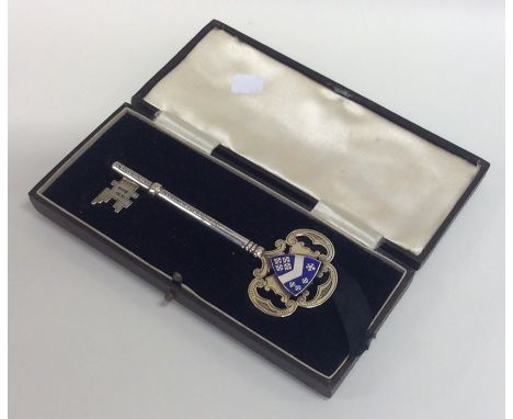 A massive silver and enamel key in fitted box. Birmingham. Approx. 22 grams. Est. £70 - £80.