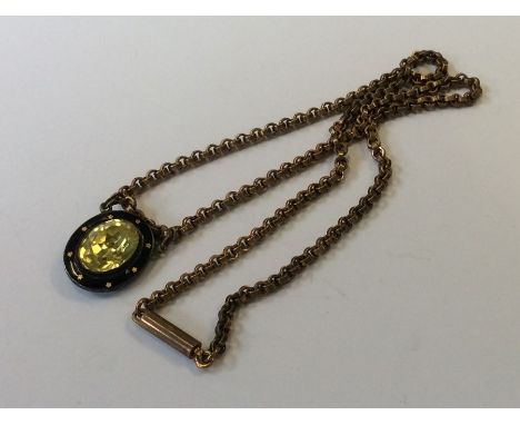 An unusual silver and enamel pendant on fine link gold chain. Approx. 16.6 grams. Est. £80 - £120.