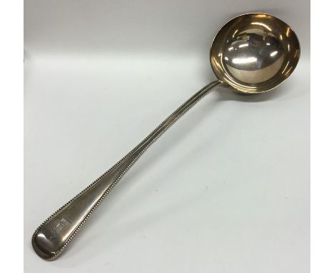 A good heavy OE and bead pattern silver soup ladle. London. By GA. Approx. 286 grams. Est. £150 - £200.