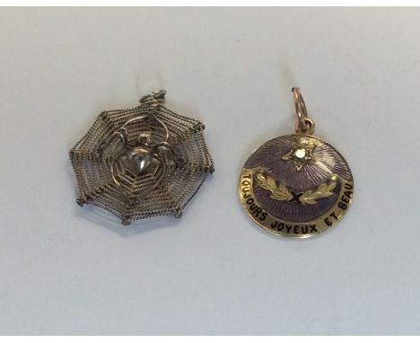 A 15 carat diamond and enamel pendant. Approx. 2 grams. Together with a silver fob. Est. £50 - £80.