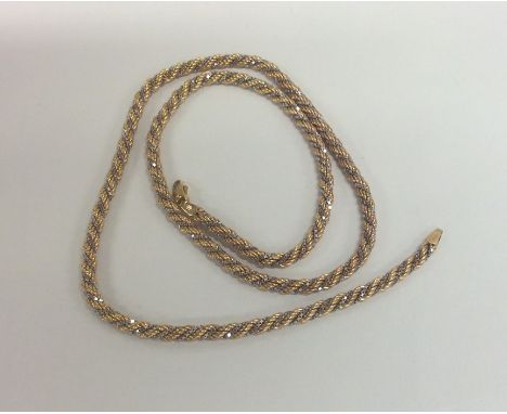 A 9 carat two colour gold twist necklace with ring clasp. Approx. 19.4 grams. Est. £200 - £300.